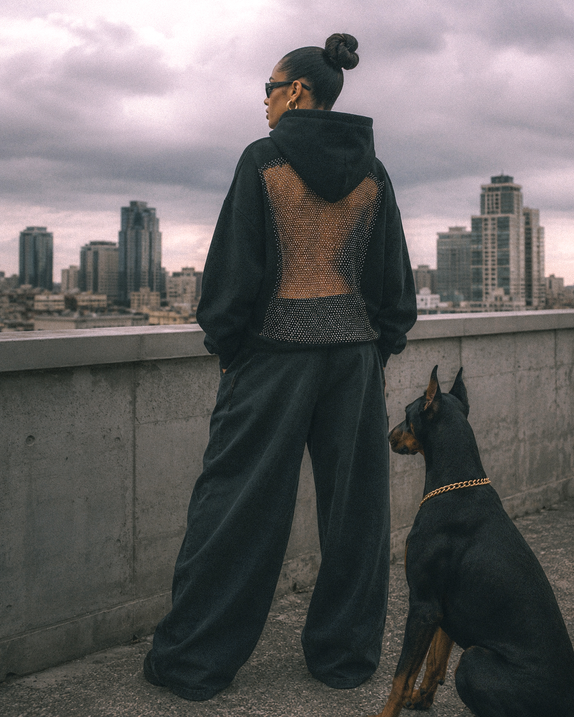 HONEY RAGE hoodie, styled on a rooftop at dusk